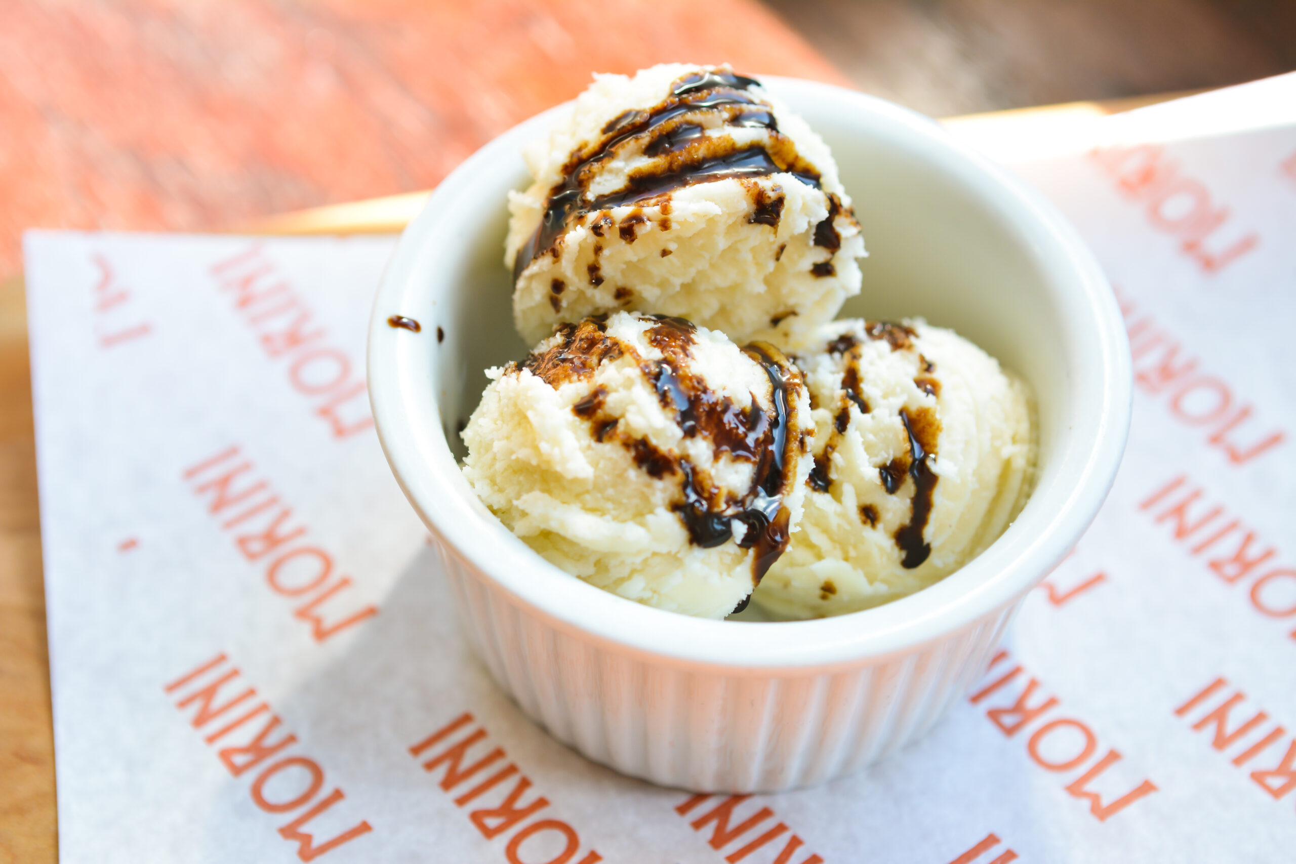 whipped parm in a dish, scooped and drizzled with balsamic to look like gelato